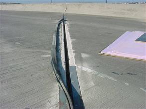 Steel armored expansion joint on a busy highway bridge